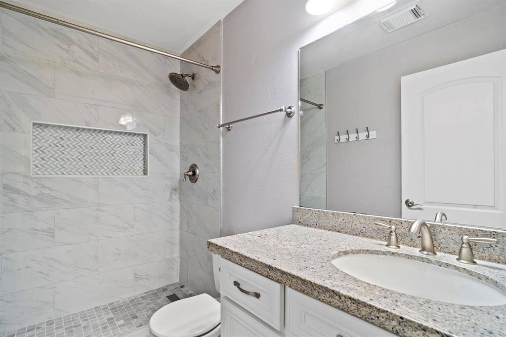 Secondary bathroom with walk in shower which was updated in 2024.