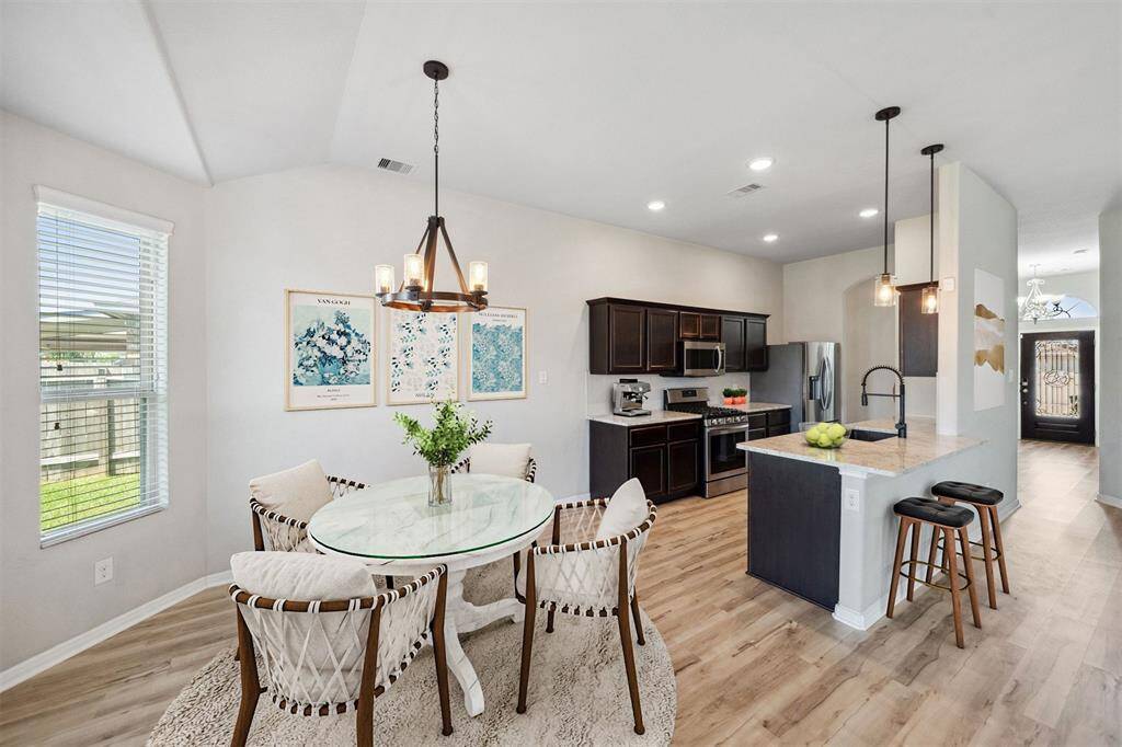 Modern kitchen and dining area, beautifully enhanced with virtual staging.