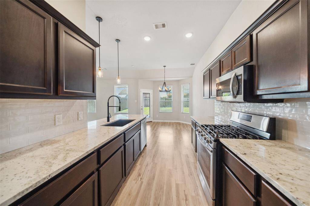 This kitchen features ample storage and generous counter space.
