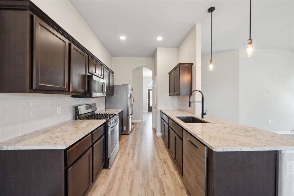 Experience the kitchen's inviting design and functionality.