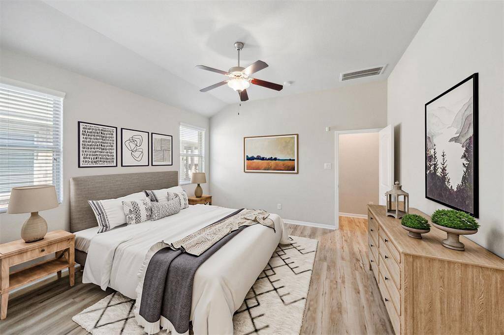 Experience the spaciousness and elegance of this virtually staged primary bedroom, designed for comfort and style.