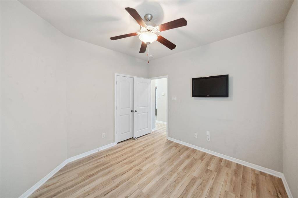 Explore the inviting secondary bedroom, perfect for guests or a home office.