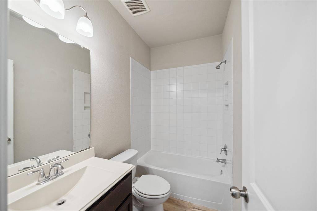 Spacious hall bathroom with convenient accessibility.