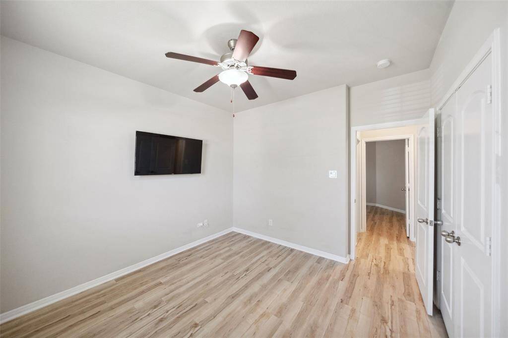 Secondary bedroom for versatile use as a home study or craft room.