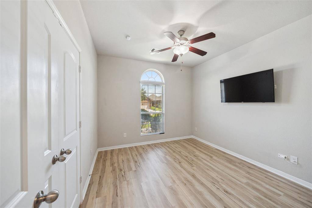 Discover the charm of this spacious secondary bedroom, perfect for guests or a home office.