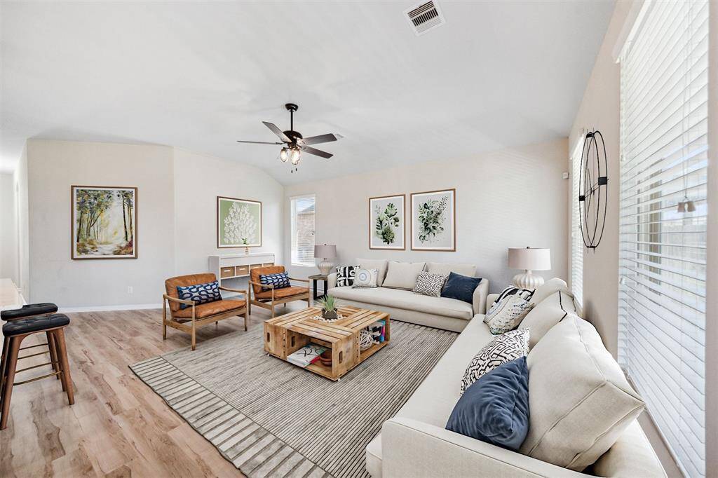 Spacious, virtually staged living room with elegant design and natural light.