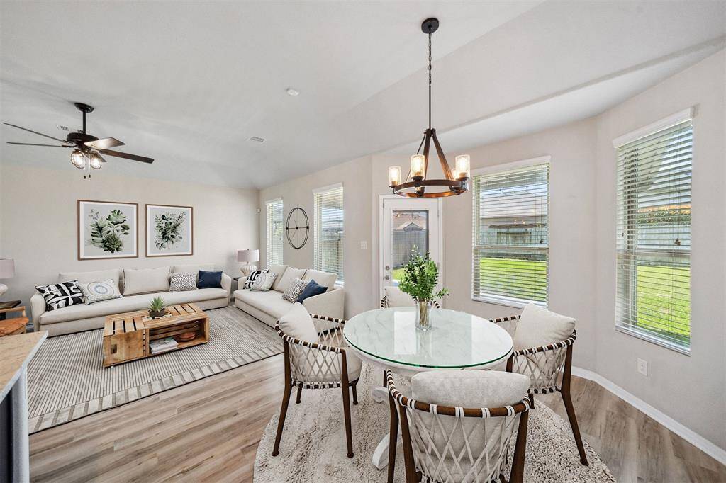 Explore the inviting charm of this beautifully staged dining and living area.