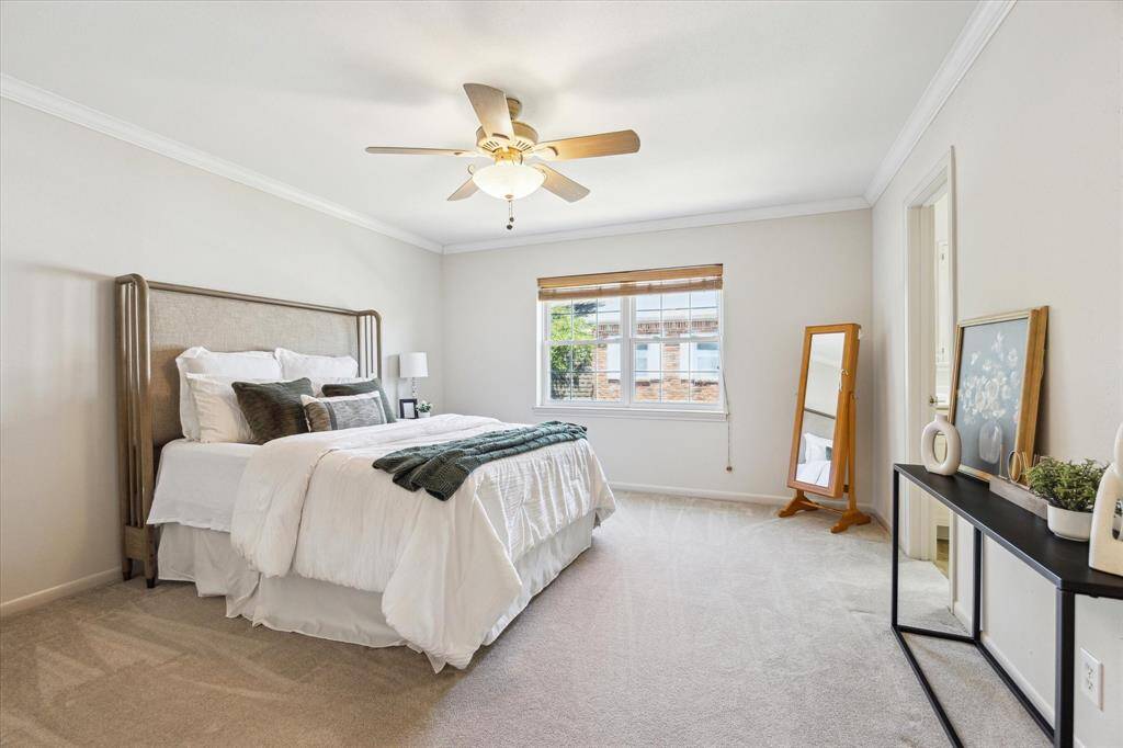 I love the extra shoe closet in the primary suite! It's tucked away down a small hallway immediately to the right once you're upstairs. Large enough for a queen or king size bed, the room has double closets in addition to the shoe closet.