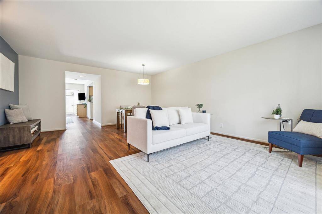 Upon entering you are greeted by wood-like laminate flooring, along with neutral and accent wall colors that make this a cozy, comfortable area for entertaining or relaxing.