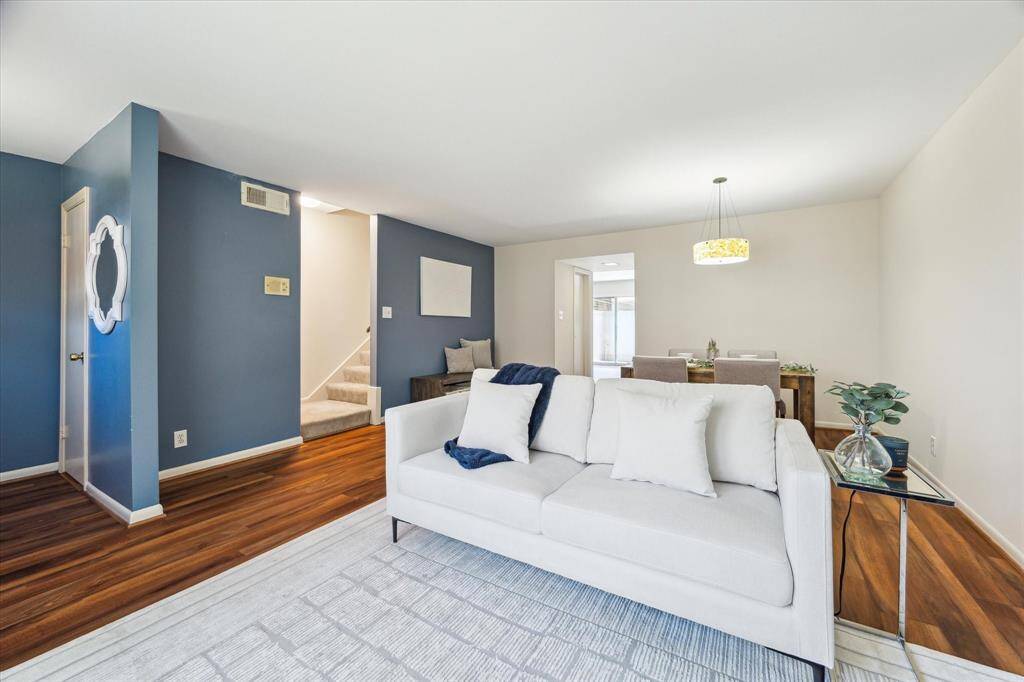 The stairs to the left lead you to the second floor, which has three bedrooms and two full bathrooms. The living and dining combination gives this home a seamless flow for hosting.