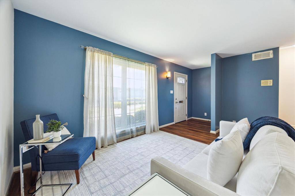 From the formal living area to the front entrance, there is a view. The replacement of the windows with new ones allows more natural light to come in, as well as contribute to energy efficiency.