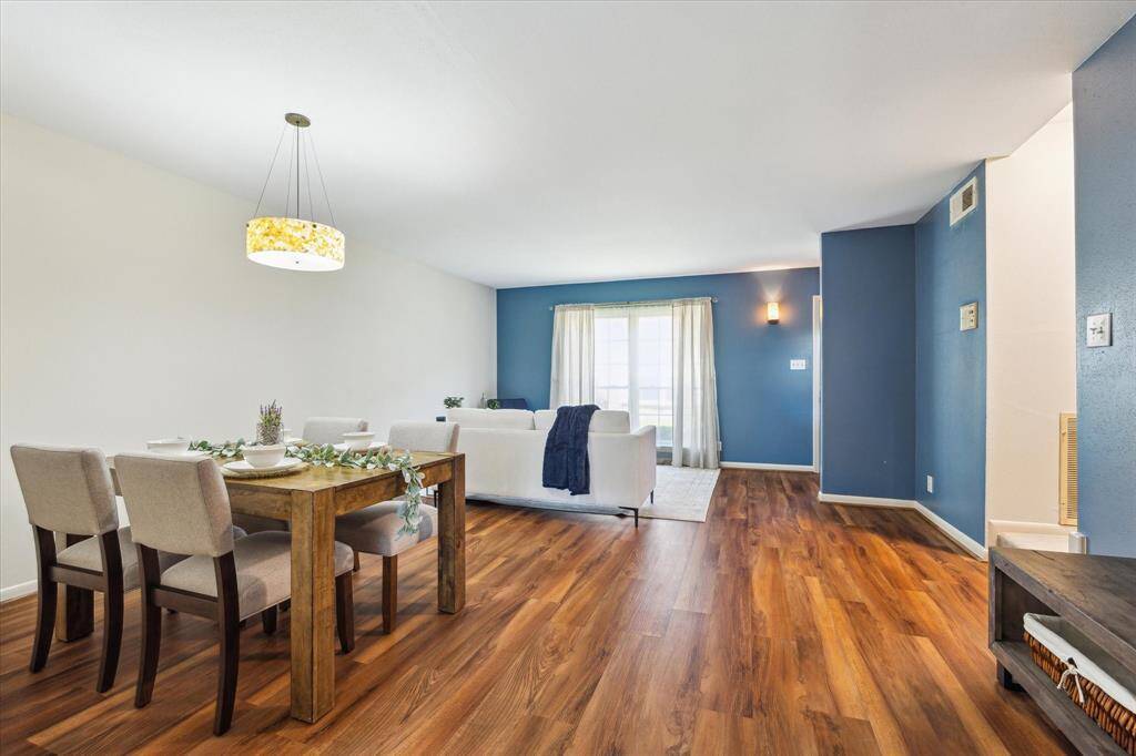 As you can see from this angle, the living and dining areas flow into each other beautifully. To the right is a little alcove that would work great as a buffet.
