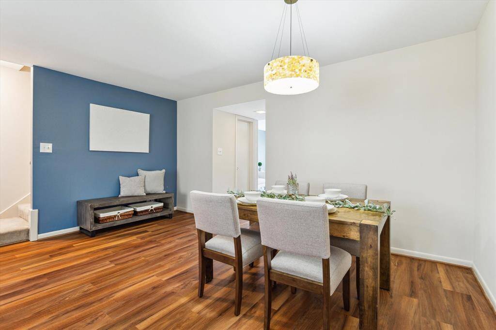 Dining room with a great view of the area where additional furniture could be added, along with a view of the proximity of the stairs.