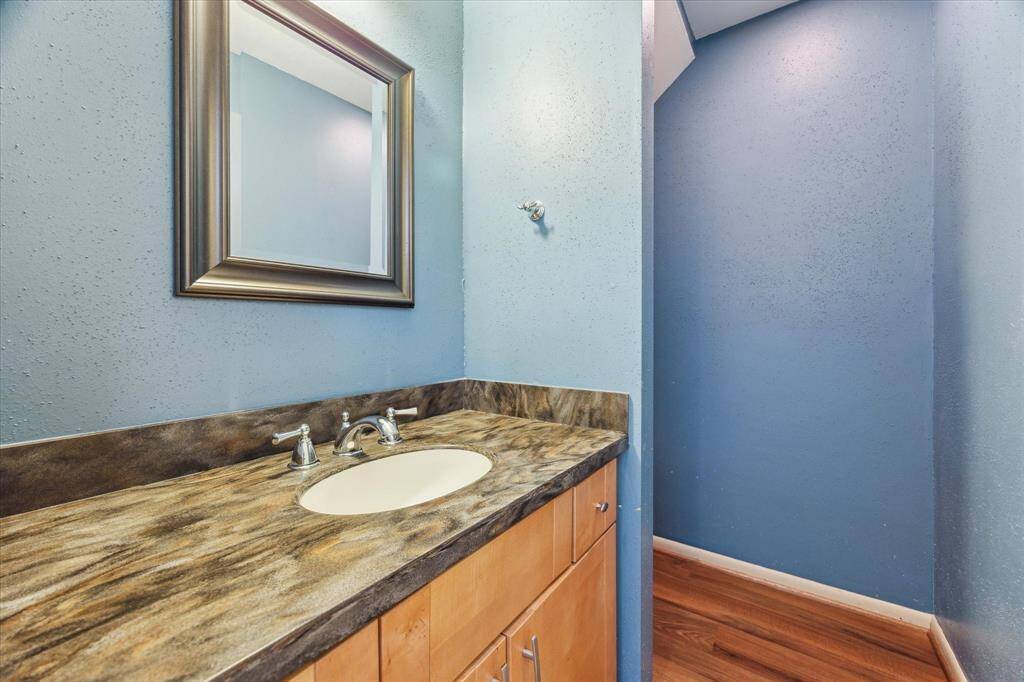 For the convenience of your guests, there is a powder room on the first floor just outside of the kitchen and den area.