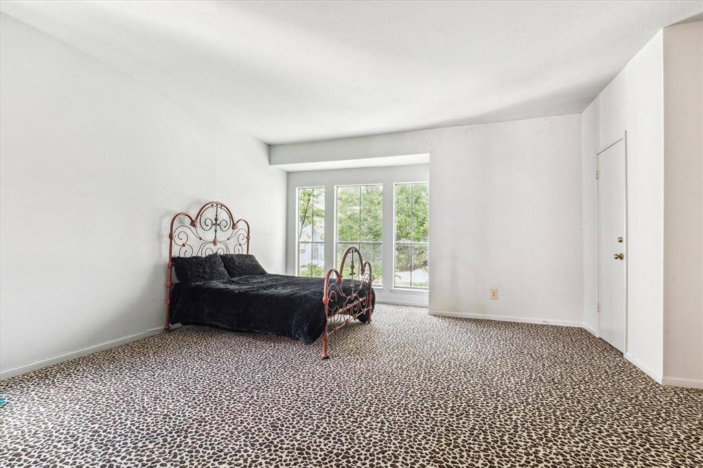 Primary Bedroom - Large primary bedroom with two walk-in closets.