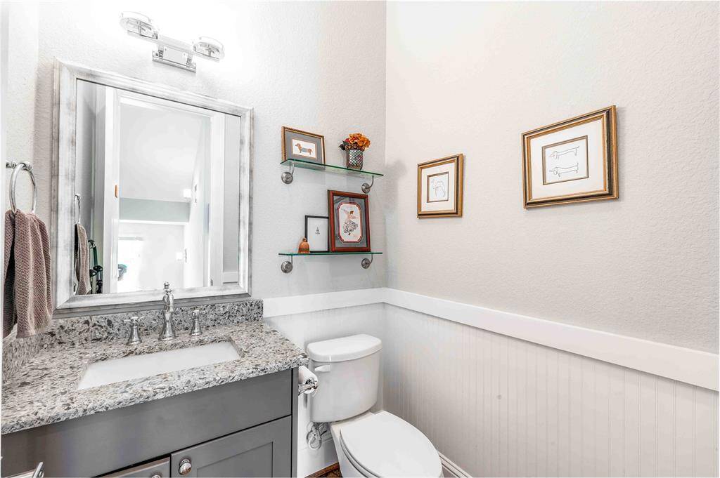 Powder room with classic wood paneling