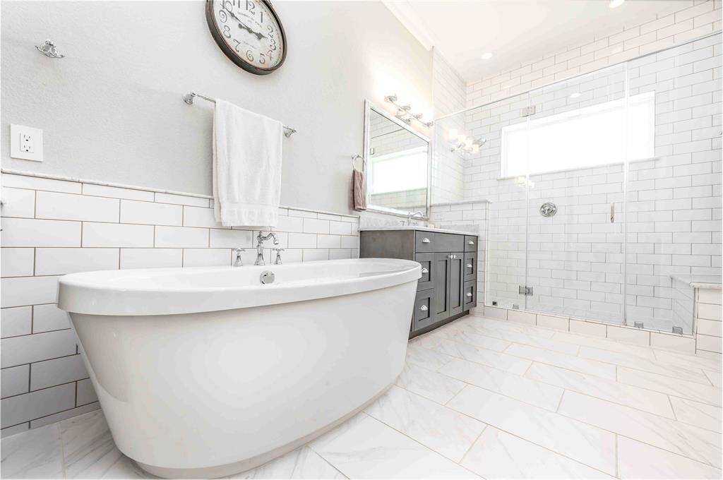 Deep soaking tub & Oversized walk in shower!