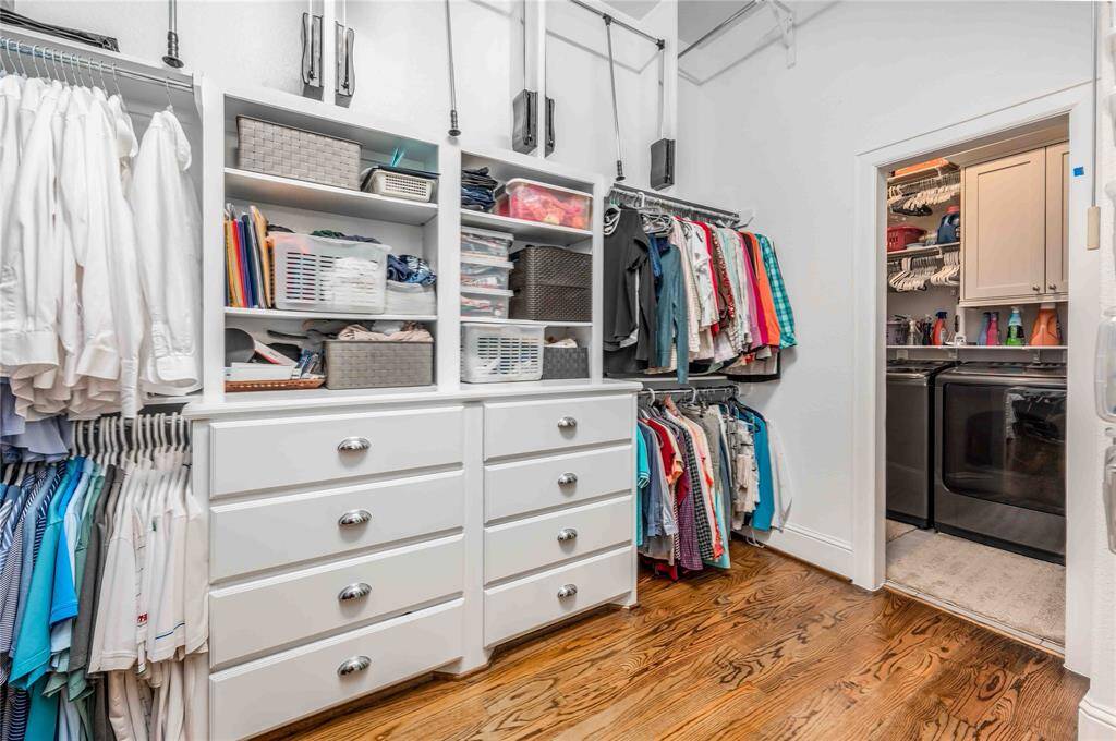 Primary Closet Offers Custom Built Ins & Laundry Pass Through.