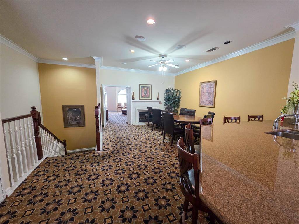 Elegant and inviting club house featuring a spacious layout, cozy fireplace, and ample seating—perfect for gatherings and relaxation.