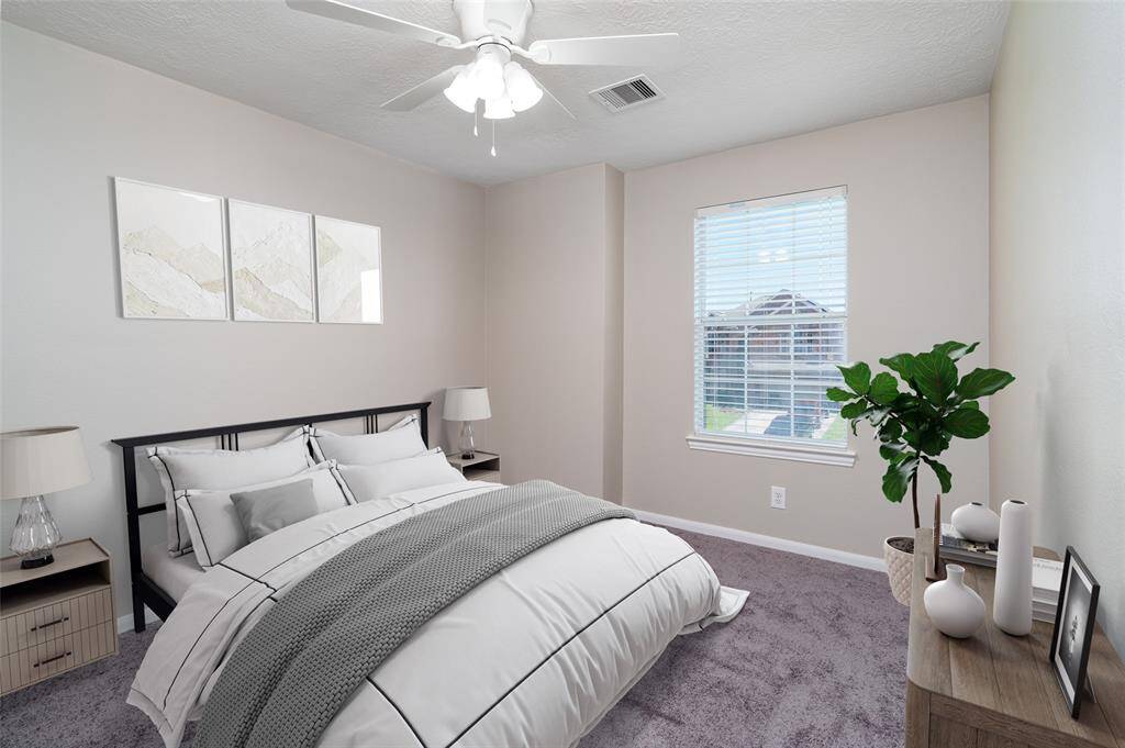 Upstairs bedroom with natural light, perfect for relaxation.(virtually staged)