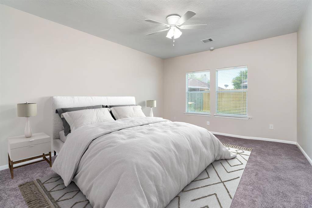 Master bedroom ample natural light, and a serene atmosphere. (virtually staged)