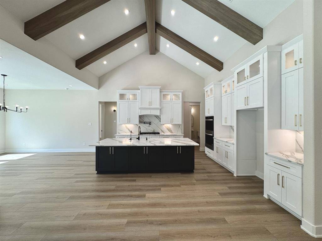 Example of Previous Built Hallmark Home. Floor Plan will vary. Chef's Kitchen to Include SS appliances, Double Ovens, 5 Burner Gas Cooktop, Granite or Quartz Counters, Walk in Pantry, Large Island Open to Living and Dining, Shaker Cabinets with Dovetail Drawers and Soft Close Hardware and More! You can add upgrades like pot filler and wood beams to the vaulted ceiling for additional amount.