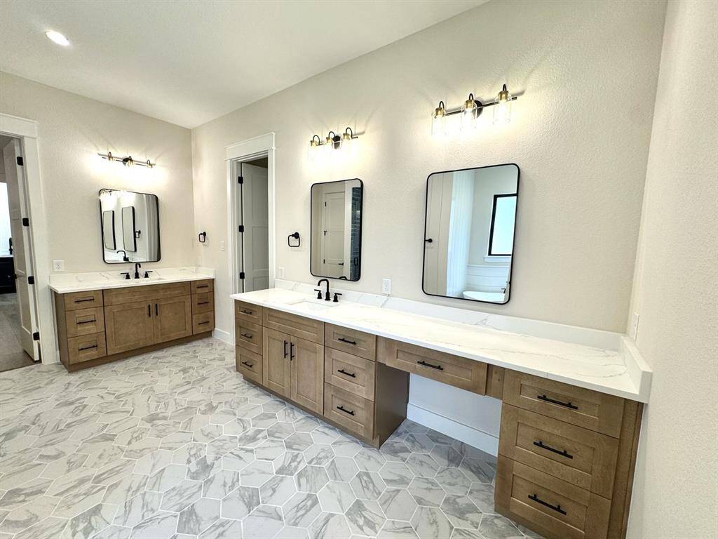 Another Previously Built Hallmark Builders' Home with Similar Included Features such as Large Free Standing Soaker Tub, Granite or Quartz Countertops, Dovetail Drawers with Soft Close Hardware, Framed Mirrors Throughout for a Luxurious Primary Bathroom. Please inquire with Hallmark Builder's Sales Team for included specifications and see floor plan for Plan 11 layout.
