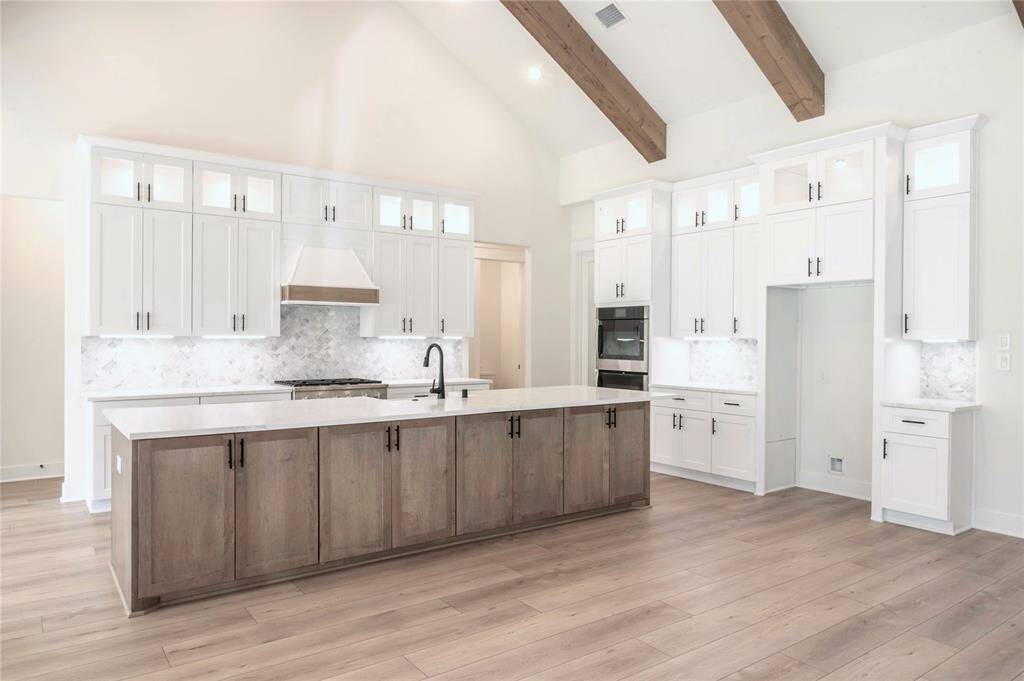 Example of previously Built Hallmark Builder's Home. Many Upgraded Features Included in Specifications. Floor Plan will vary. Chef's Kitchen to Include SS Whirlpool appliances, Double Ovens, 5 Burner Gas Cooktop, L3 Granite or Quartz Counters, Walk in Pantry, Large Island Open to Living and Dining, 3rd row lighted Shaker Cabinets, Dovetail Drawers and Soft Close Hardware and More! Please inquire with Hallmark Builder's Sales Team for included specifications. Personalize Selections Now!