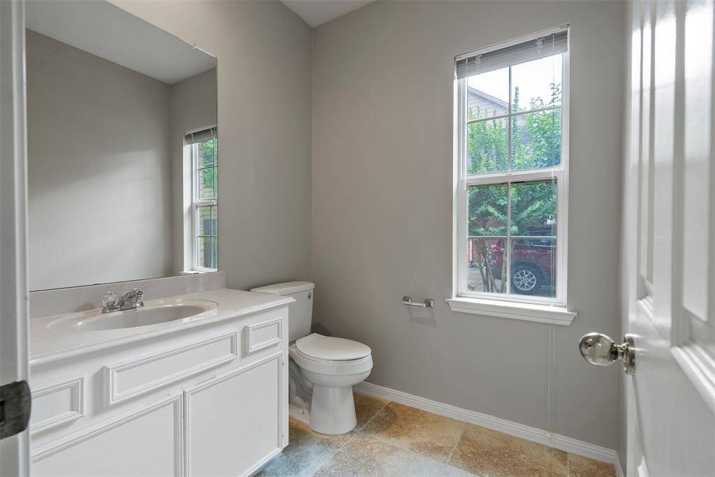The 1/2 bath adjacent to the laundry room is perfect for guest.