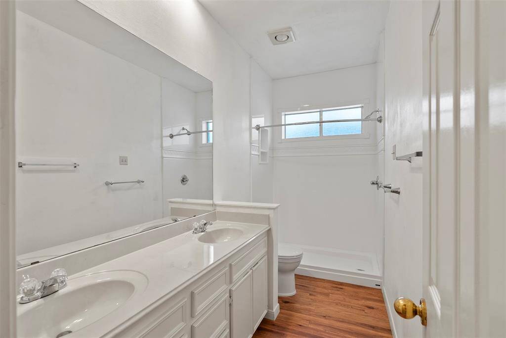 Hallway bath has double sinks and a large shower!