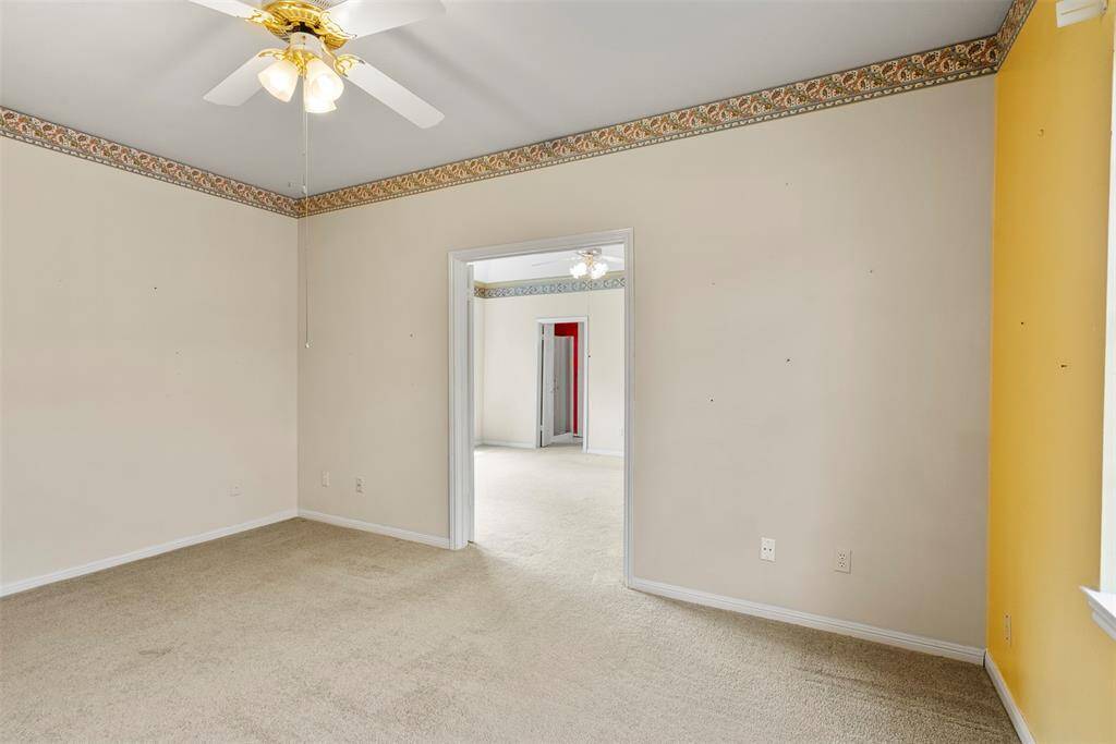This 4th bedroom has access to the primary bedroom along with  access directly to the hallway.