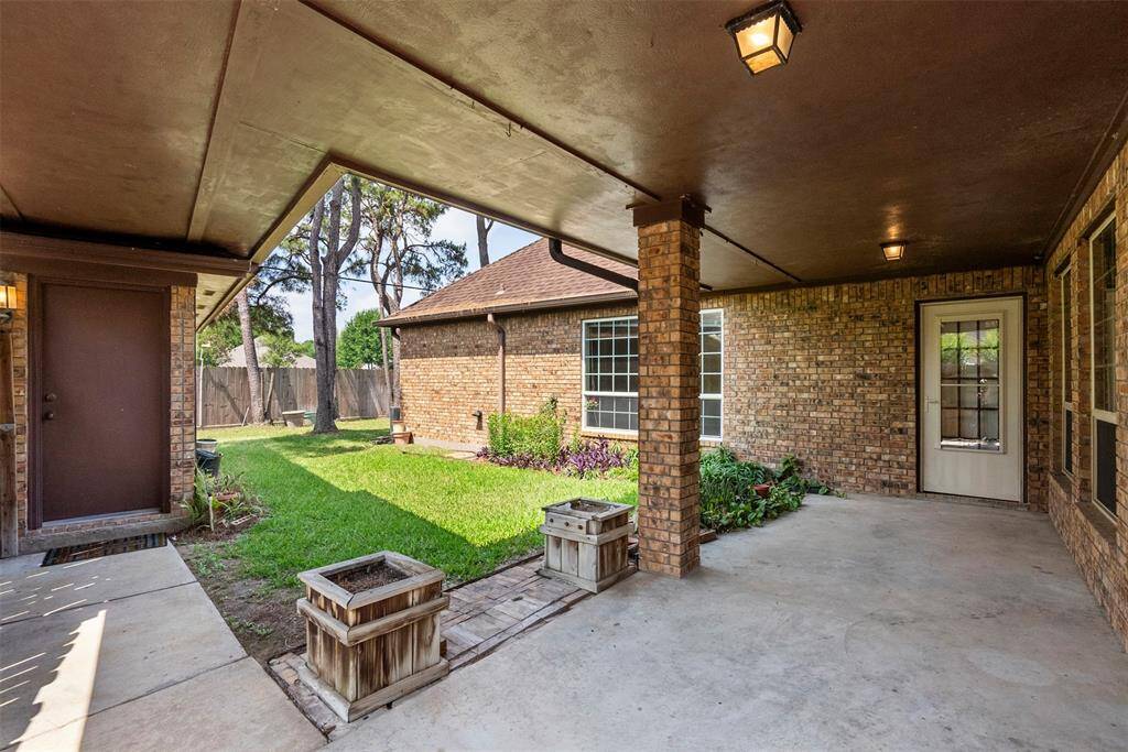 A lovley covered porch allows a place to sit  and enjoy the wildlife.