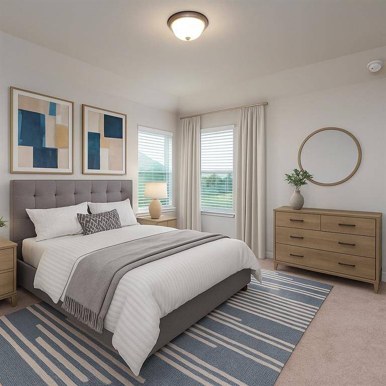 This inviting bedroom features soft carpet underfoot, classic dome lighting, and windows with privacy blinds that let in just the right amount of natural light.
