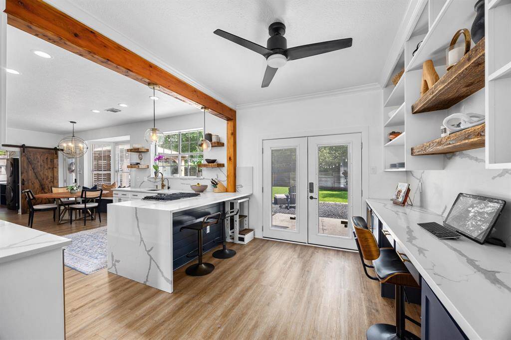 Calacatta Quartz throughout this modern updated kitchen