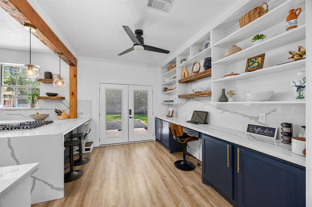 Chic coffee bar & workspace with open shelving and extra storage.
