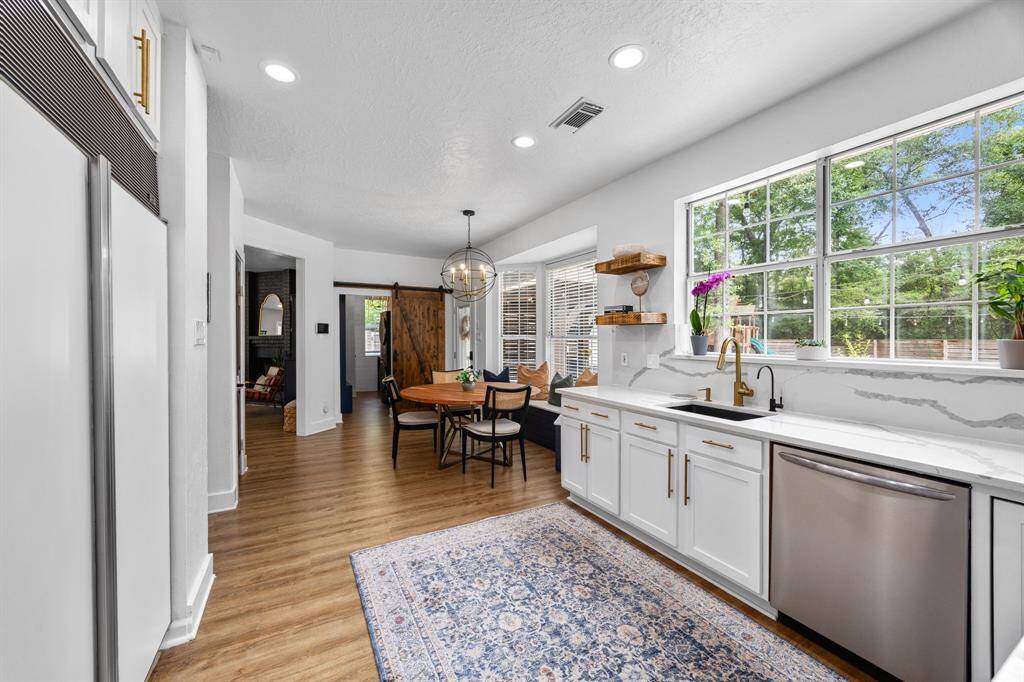 Light & bright kitchen with barn door to laundry