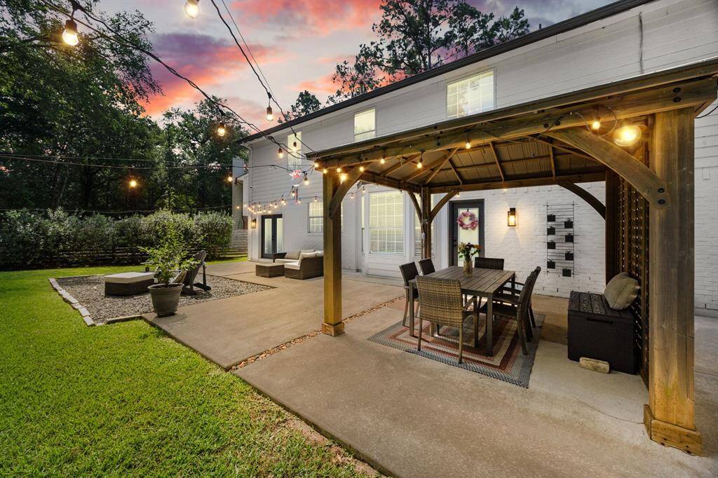 This private backyard is filled with lights creating a little piece of paradise