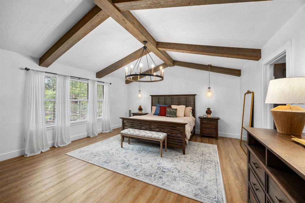This primary bedroom is a showstopper for sure