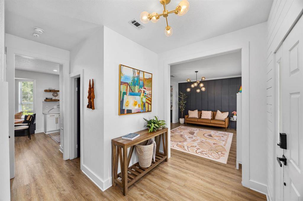Luxury Vinyl Plank and modern lighting throughout