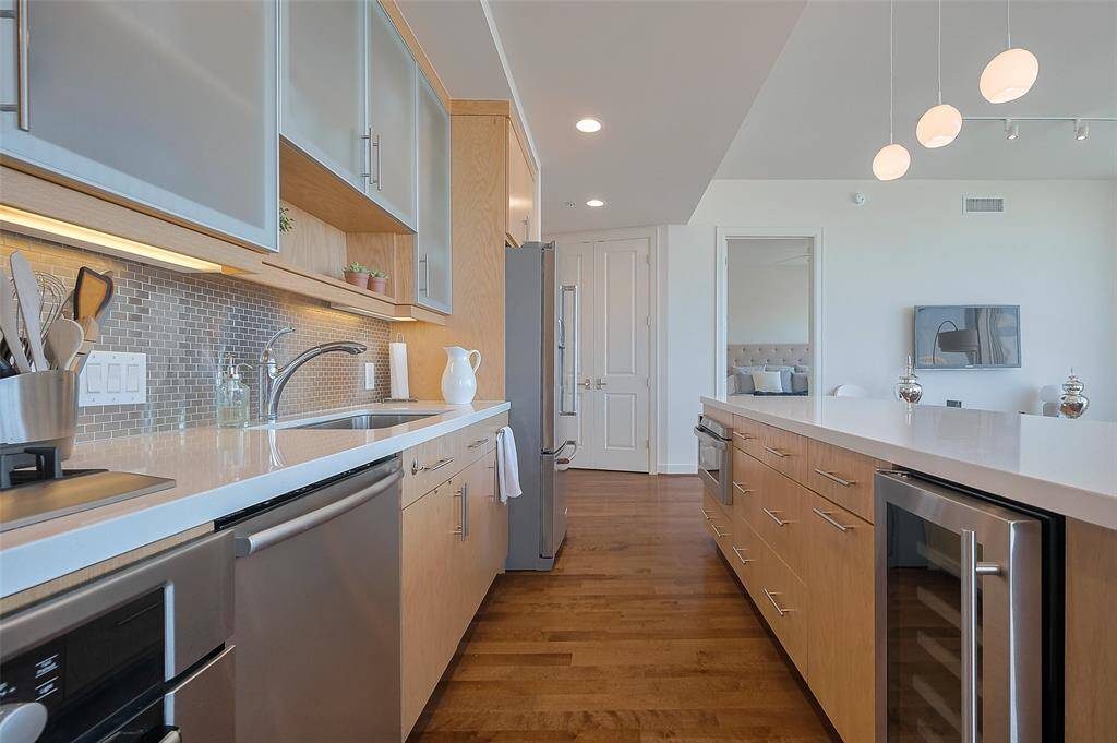 Top-of-the-line stainless steel appliances are built-in for a clean, streamlined look.