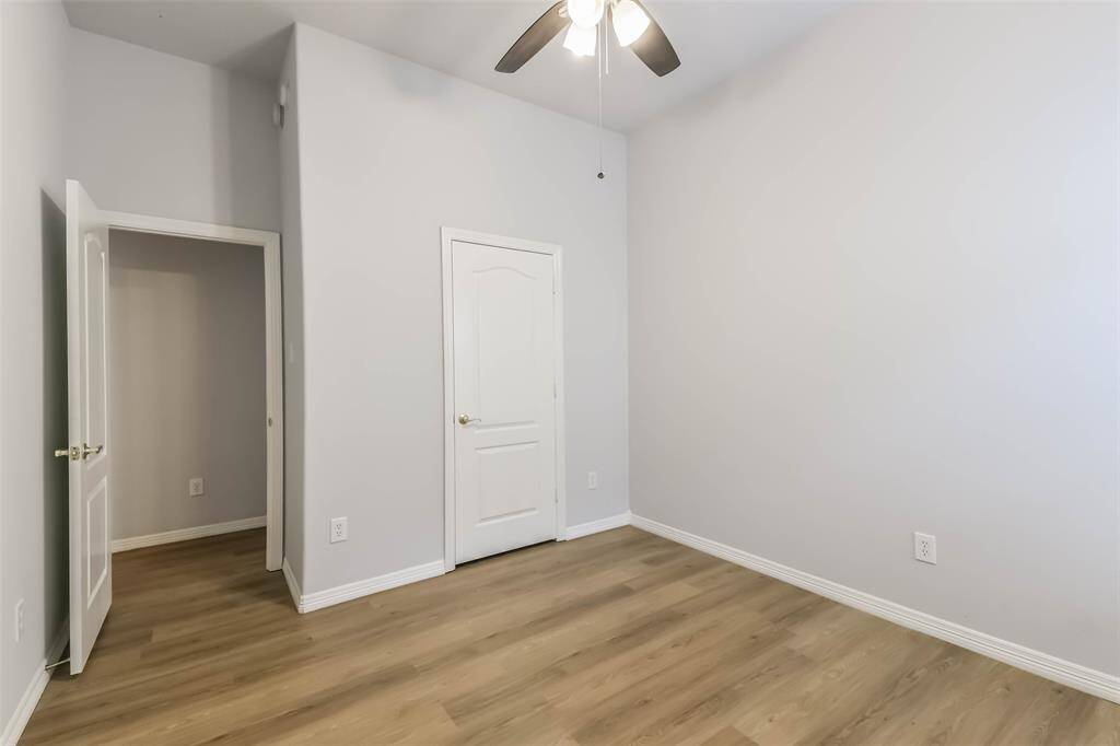 Secondary Bedroom – Comfortable space with natural light and LVP flooring.