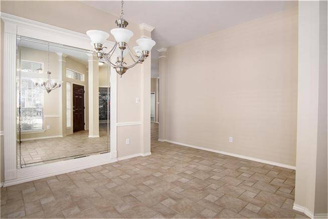 Another view of dining area with mirrored wall.