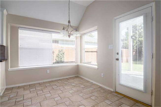 Bright and airy breakfast nook with large windows, leading to the backyard. Perfect for morning coffee and casual dining.