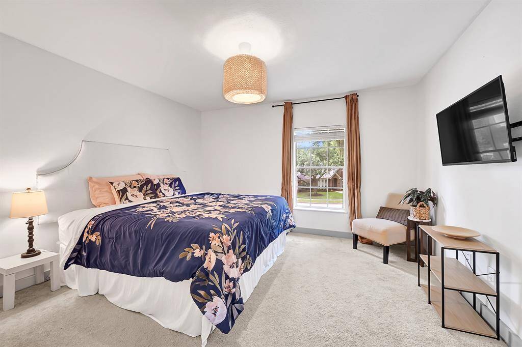 Secondary bedroom measuring 13'1" x 15'5" perfect for comfort and flexibility.