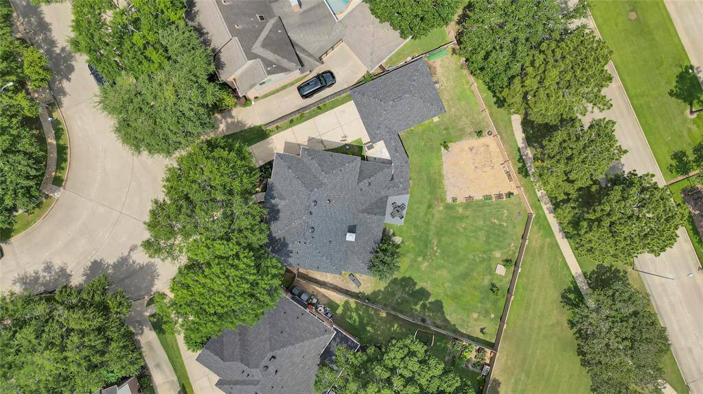 Aerial view highlighting the corner lot and generous backyard, perfect for outdoor activities and future enhancements.