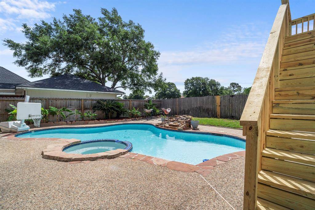 From the basketball hoop to the built-in seating and wide deck, this pool was designed for fun and relaxation alike.
