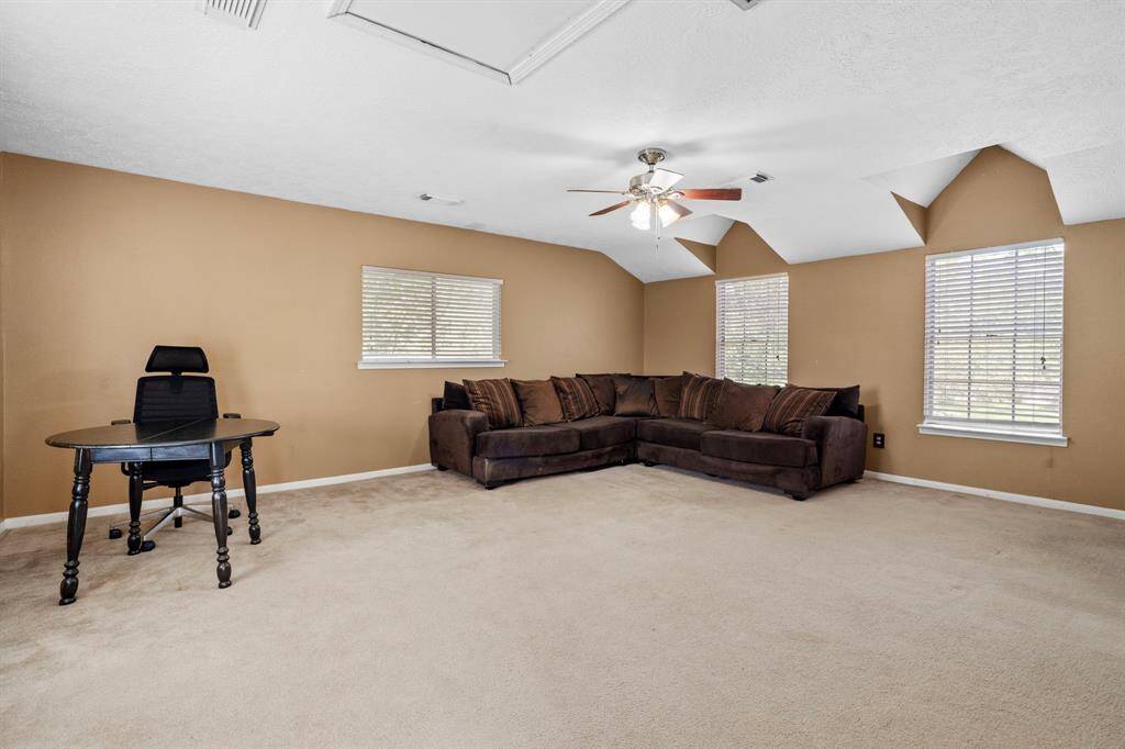 With its own private entrance, this upstairs garage apartment includes a full bathroom, making it ideal for guests, hobbies, or rental potential.