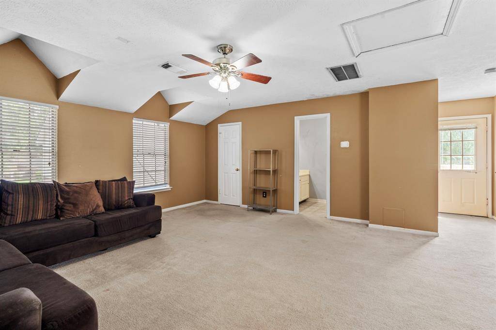 This oversized space offers plenty of room to relax, entertain, or work, with multiple windows providing great natural light and flexibility for layout and use.