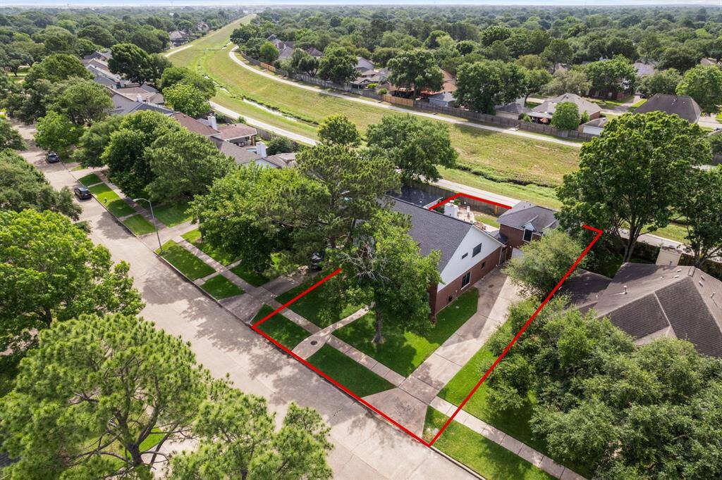 The home sits on a spacious lot with direct access to the adjacent greenbelt trail, offering a rare blend of privacy and walkability.