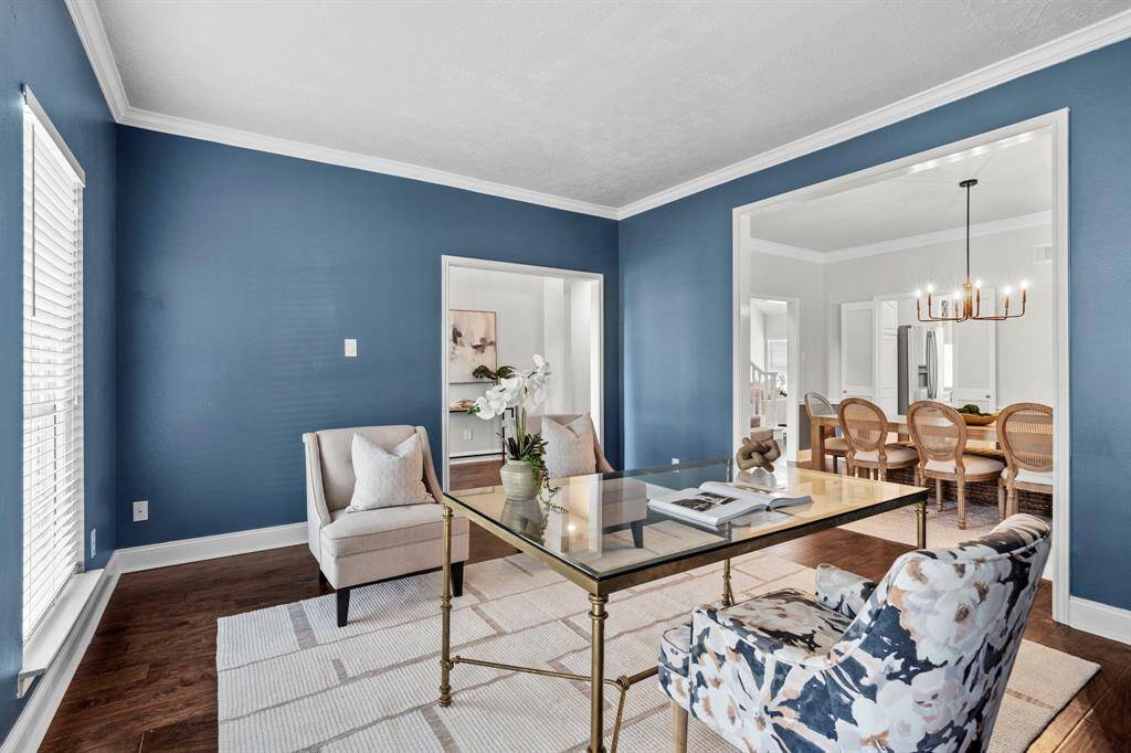 The office flows seamlessly into the formal dining area, offering a flexible layout that can accommodate working from home, studying, or creative pursuits in a bright and connected space.